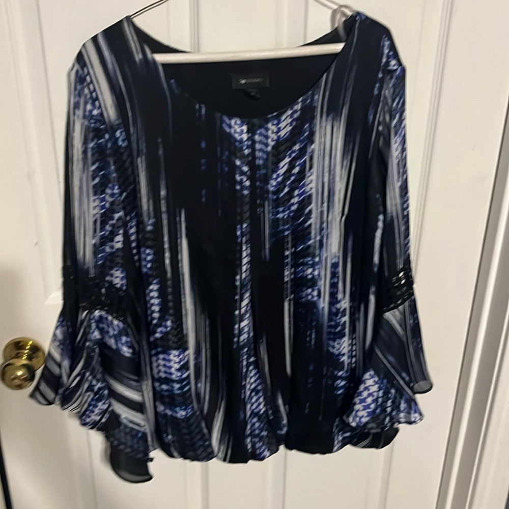 Black blue and white blouse.